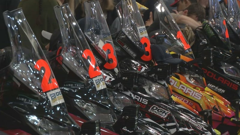 Sleds line the Curtis D. Menard Center in Wasilla ahead of the 2023 Iron Dog.