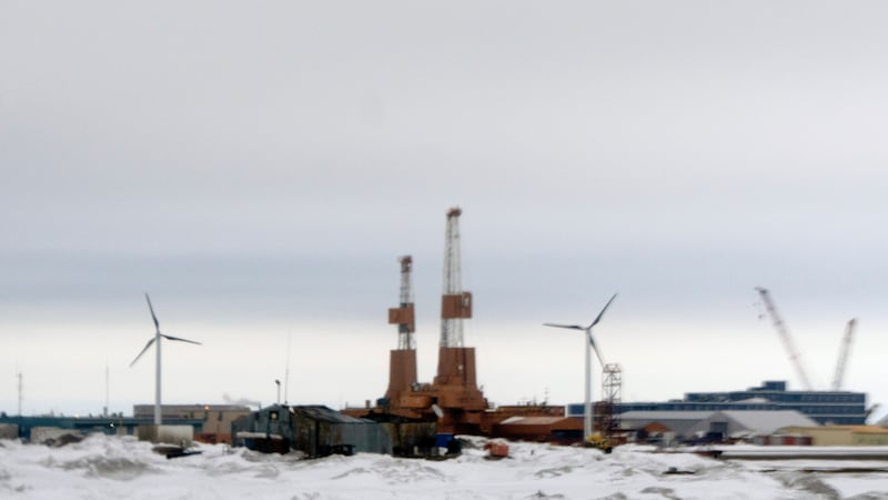 This image taken through a window of a plane shows wind turbines in Deadhorse, Alaska on...