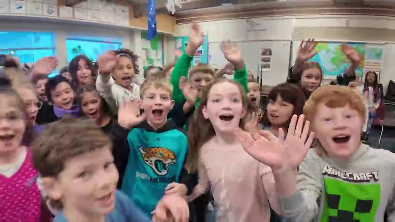 Weather Lab: O’Malley Elementary students teach Melissa Frey how to deliver the weather in...