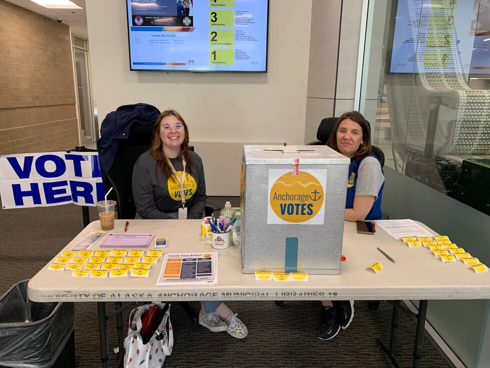 Deputy Municipal Clerk Jasmine Acres and Election worker Jennifer Veneklasen wait to direct...