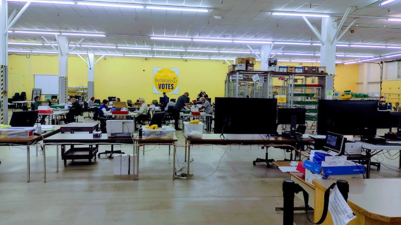 Workers process ballots at Anchorage's Election Center ahead of Tuesday's mayoral runoff election