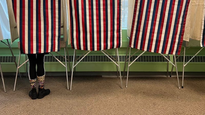 A person votes inside a polling booth on April 2 during Anchorage's Municipal Election.