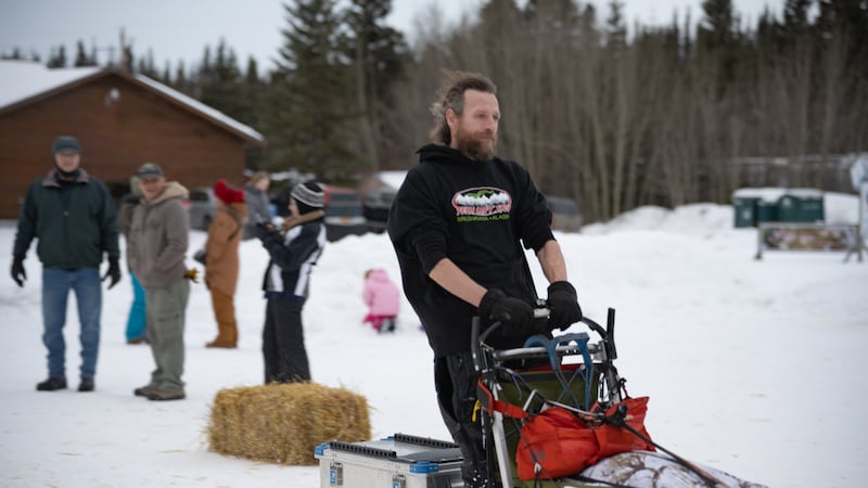 Jessie Holmes speeds by in the 2025 Copper Basin 300 sled dog race.