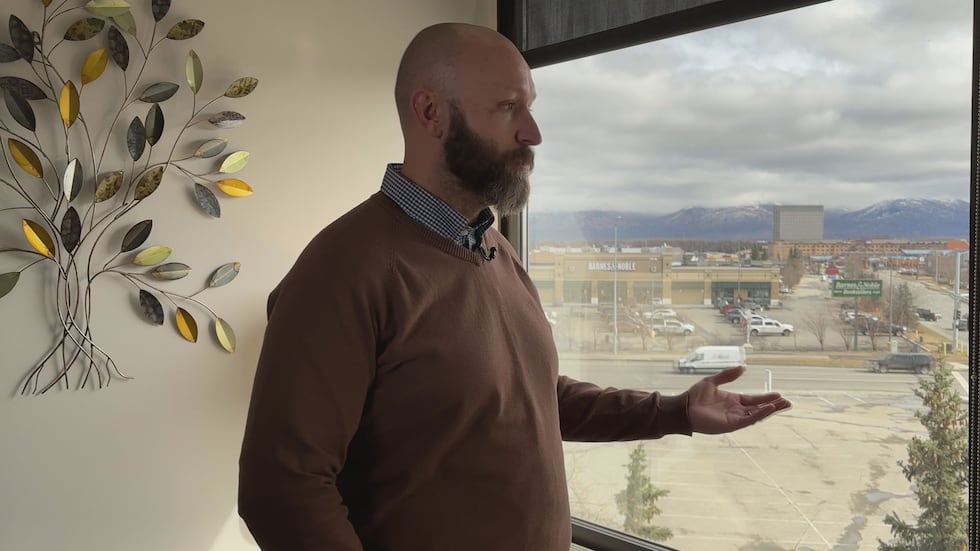 Casey Schuler's office window looks right into midtown traffic.