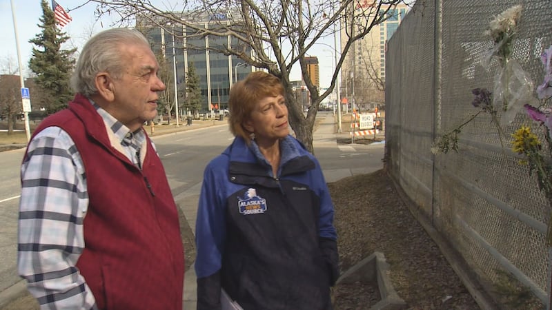 Albert Whitehead looks at flowers and cards left on the empty pen of Star the reindeer