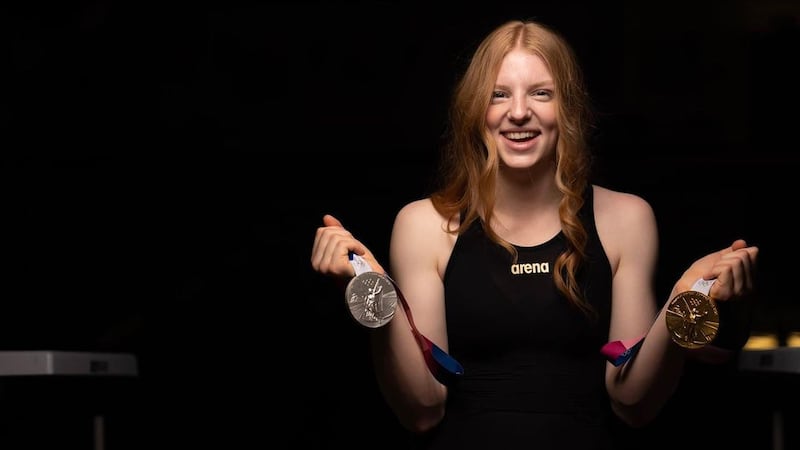 Seward's Lydia Jacoby poses with her Olympic medals as she announces her partnership with...