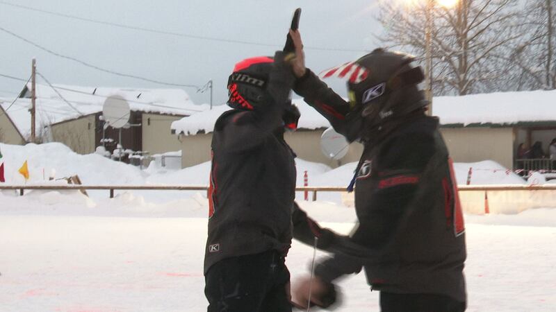 Team 10, Mike Morgan and Chris Olds, celebrate as the first team to the McGrath checkpoint...