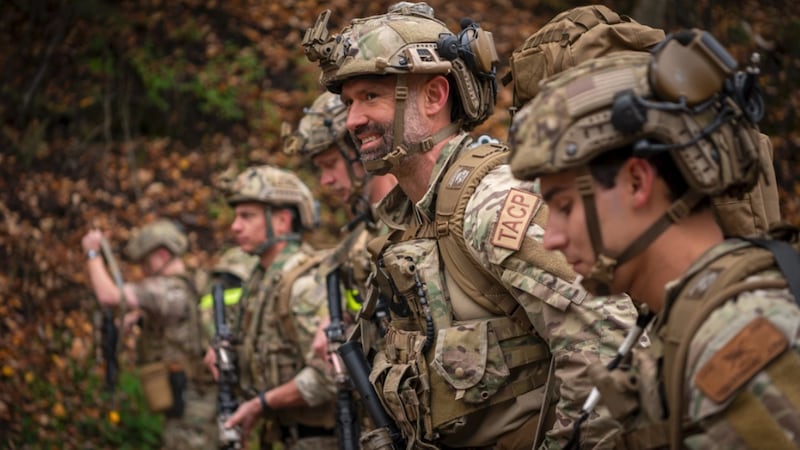 U.S. Air Force Tactical Air Control Party (TACP) specialists line up near Otter Lake for a...
