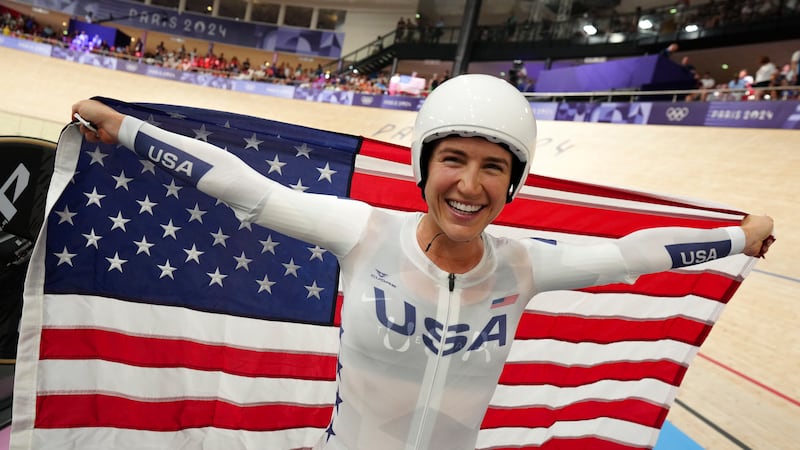 Kristen Faulkner of the United States celebrates winning the gold medal in the women's team...