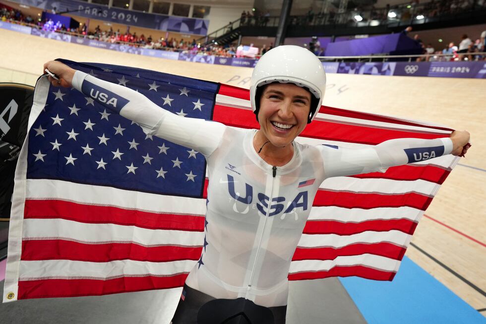 Kristen Faulkner of the United States celebrates winning the gold medal in the women's team...