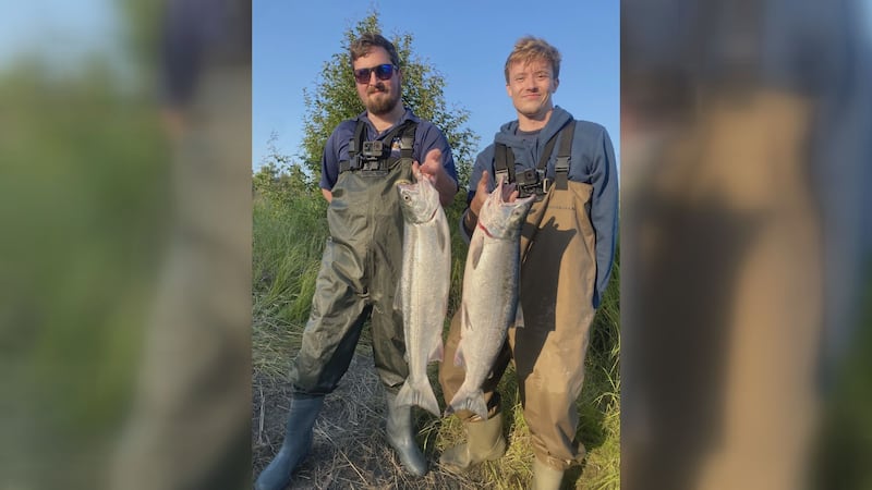 Alaska's News Source sports team members Tyler Lane (left) and Jordan Rodenberger (right) pose...