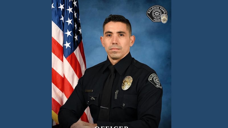 Officials identified the slain officer as Samuel Riveros. The police chief said Riveros was an...