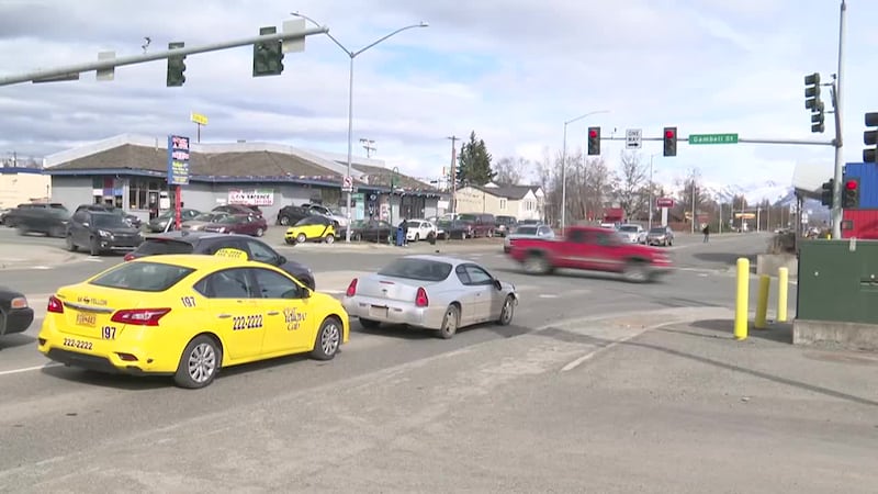Traffic speeds through the intersection of Gambell Street and 15th Ave