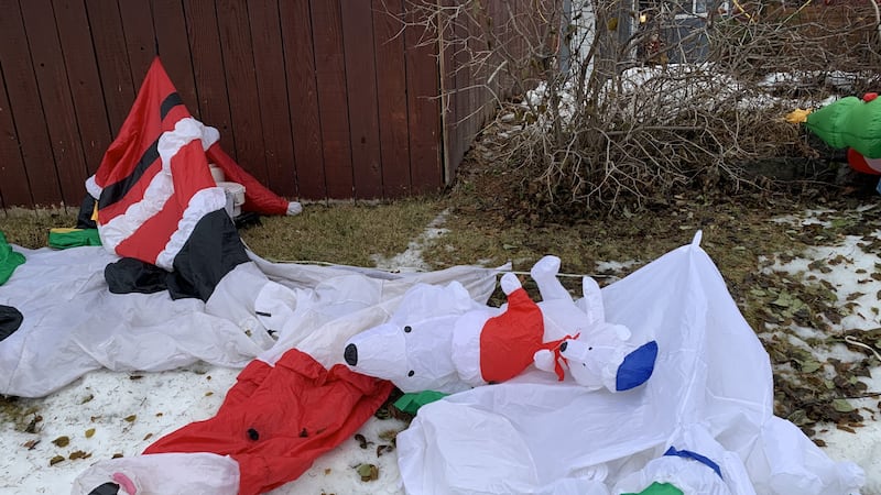 Holiday inflatables took a beating after a Monday night wind storm