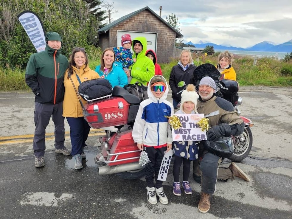 Patrick Romeo poses for a photo with his family at the finish line of the 2024 Hoka Hey...