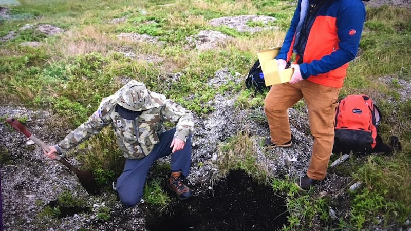 Ian Putnam (right), a Coast Guard physical scientist, and Edmund Gaines, a Coast...