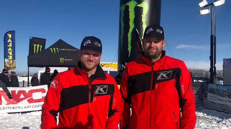 Tyler Aklestad and Nick Olstad pose at the finish line of the 2023 Iron Dog on Feb. 25, 2023.