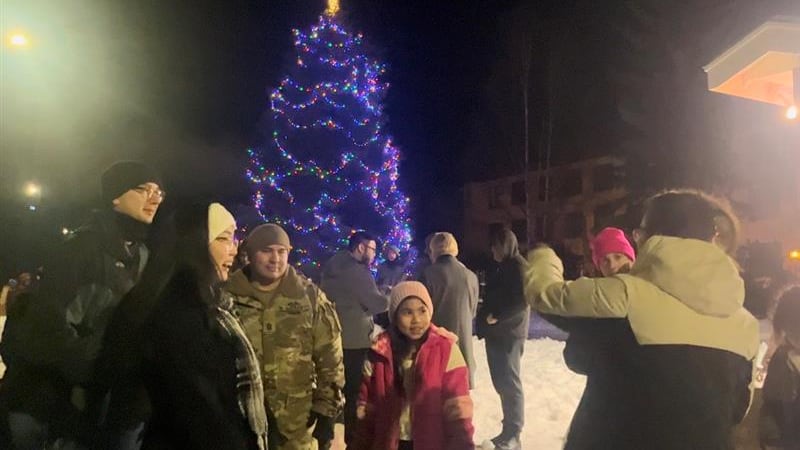 Families celebrate the annual Christmas tree lighting on JBER.
