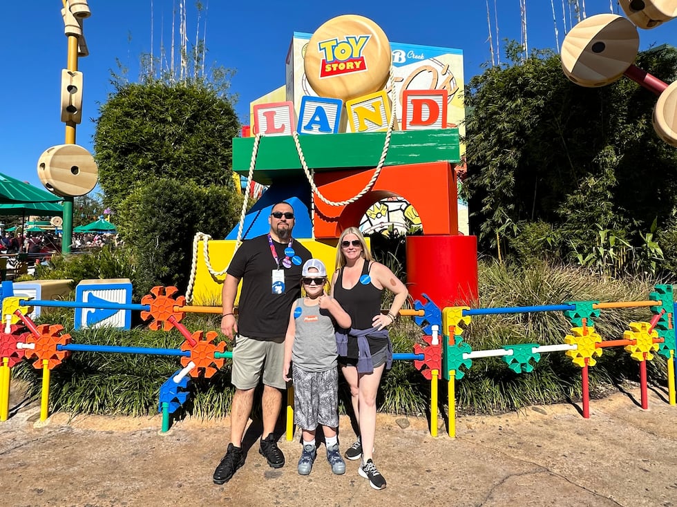 Frank, Phoenix and Melissa Mendoza at Disney World.