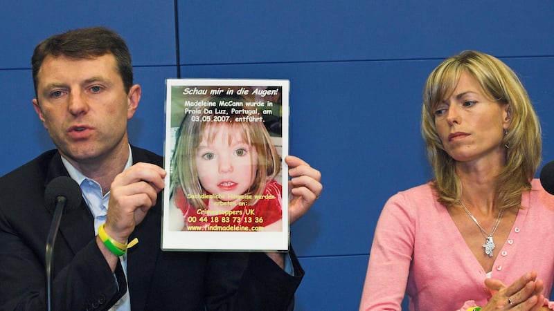 FILE - Gerry, left, and Kate McCann, parents of four-year old Madeleine McCann, present a...