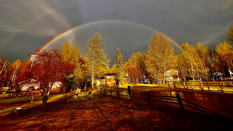 A golden light and a rainbow after a storm passes. Hail and rain first, then a...
