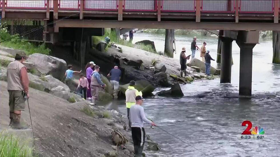 Anglers try their hand at catching silver salmon at Ship Creek.