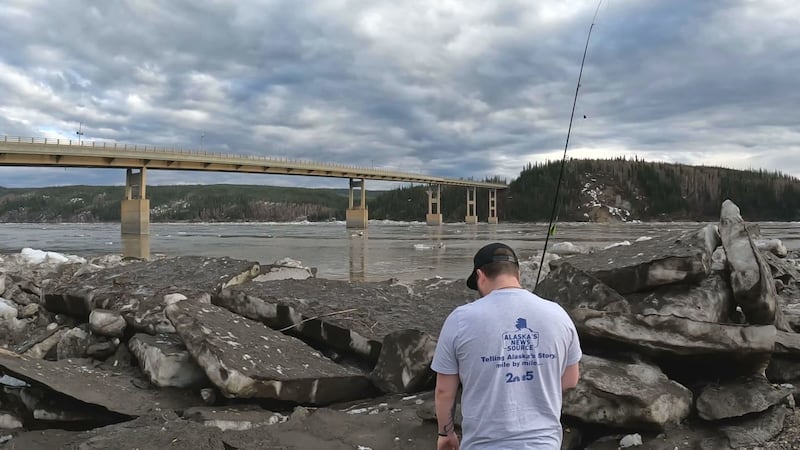 A disappointed Tyler Lane stands on the banks of the Yukon River in search of fish.