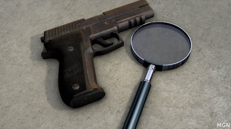 Generic magnifying glass and gun photo