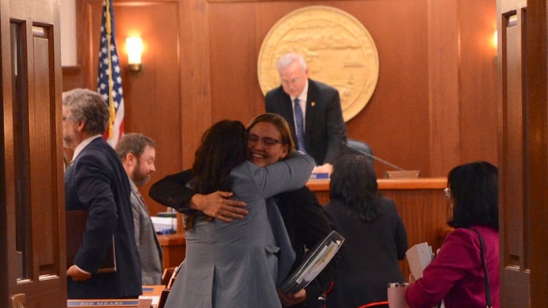 Rep. Ashley Carrick, D-Fairbanks, hugs Rep. Jamie Allard, R-Eagle River, after the Alaska...