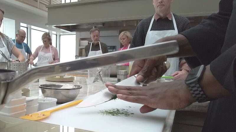 Chef Drake Robertson chops dill during a recent class onboard Silversea's Silver Nova.