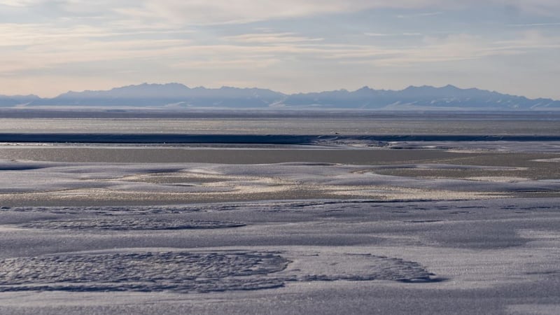 The Kaktovik Lagoon and the Brooks Range mountains of the Arctic National Wildlife Refuge are...