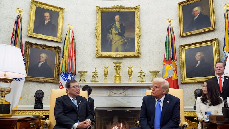 President Donald Trump speaks with Japanese Prime Minister Shigeru Ishiba in the Oval Office...