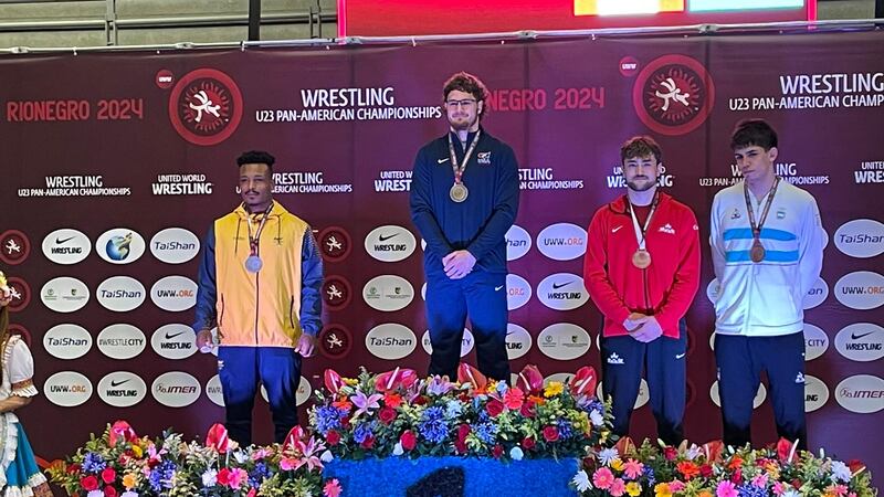 Palmer's Levi Hopkins stands atop the podium after winning gold at the U23 Pan-American Games.